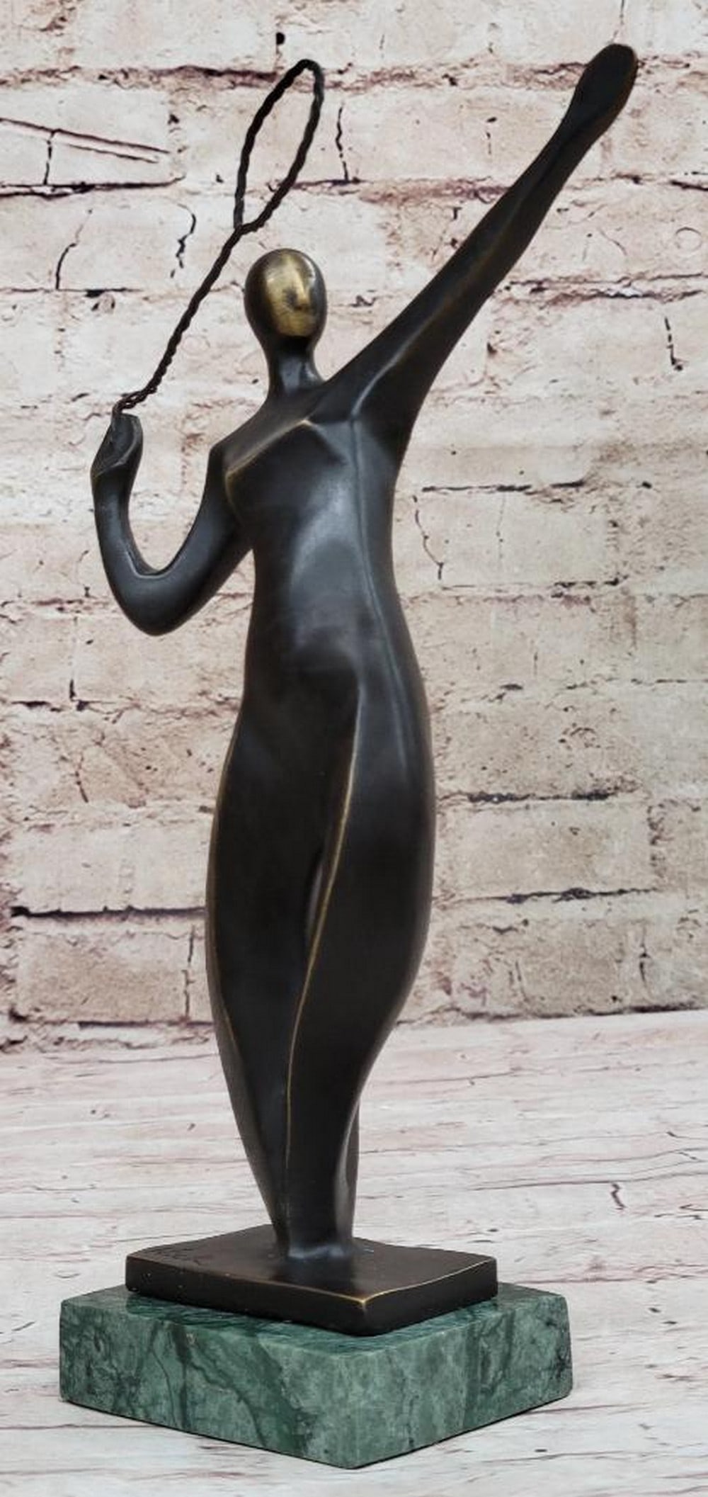 Signed Original Serving Badminton Player Bronze Sculpture - 8" x 6.5": Signed Original Serving Badminton Player Bronze Sculpture - 8" x 6.5" Badminton appeared as a demonstration sport at the Games of the XX Olympiad in Munich, in 1972. It joined the Olympic prog