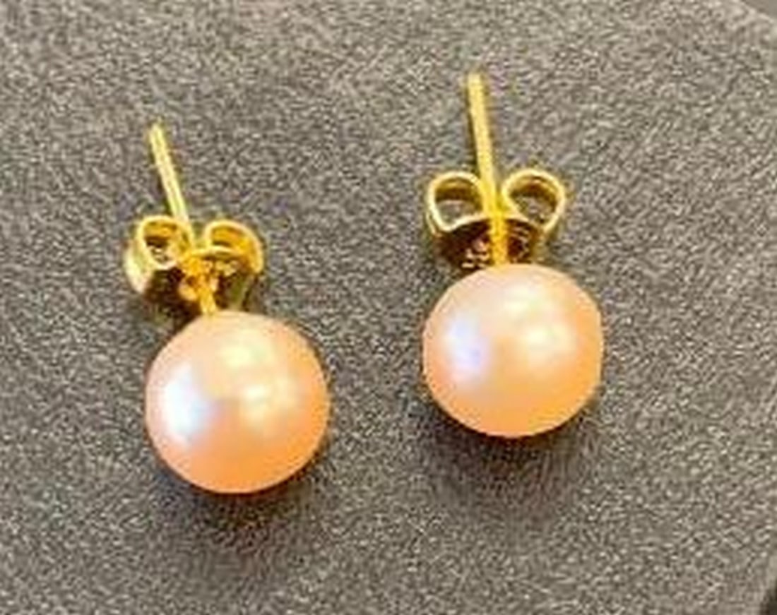 Classic Pearl Studs: Classic Pearl Studs Elevate your everyday look with these timeless pearl stud earrings, crafted from sterling silver and finished with a luxurious gold plating. Elegant, lightweight, and perfect for