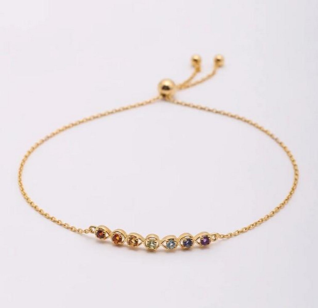Harmony in Color: Harmony in Color - Semi-Precious Gemstone Wraparound Bracelet This delicate bracelet is a celebration of color and light. Imagine adorning your wrist with a spectrum of semi-precious gemstones, each