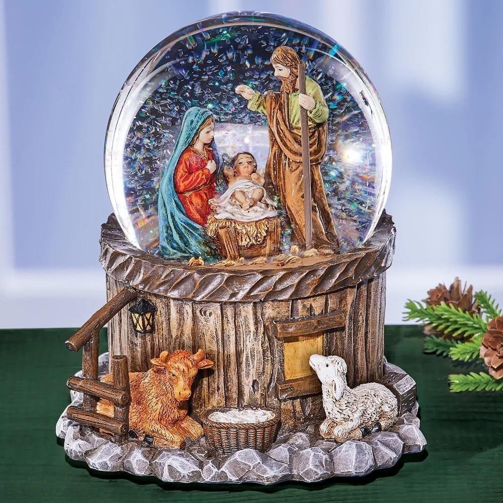 Glittering Nativity Silent Night Musical Snow Globe: Glittering Nativity Silent Night Musical Snow Globe A beautifully detailed Nativity scene rests at the heart of this glittering snow globe, capturing the wonder of the first Christmas. As the