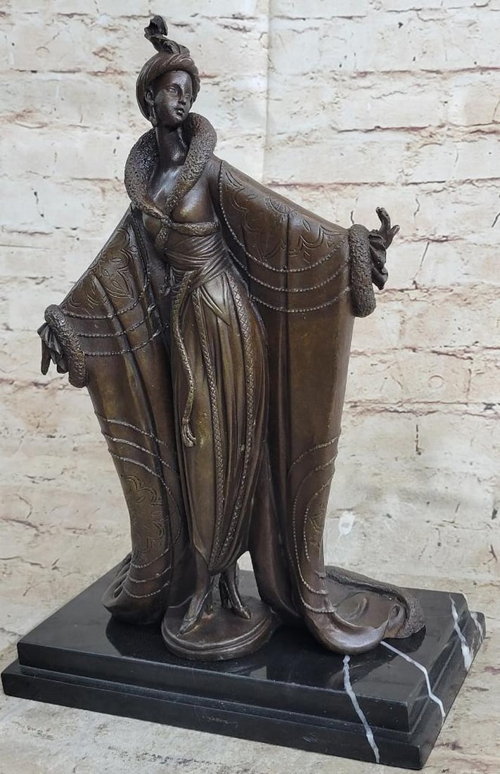 Art Deco Dancer in the Manner of Erte Bronze Statue - 14" x 9.5": Art Deco Dancer in the Manner of Erte Bronze Statue - 14" x 9.5" This elegant bronze sculpture embodies the glamour and sophistication of the Roaring Twenties, inspired by the iconic Art Deco 