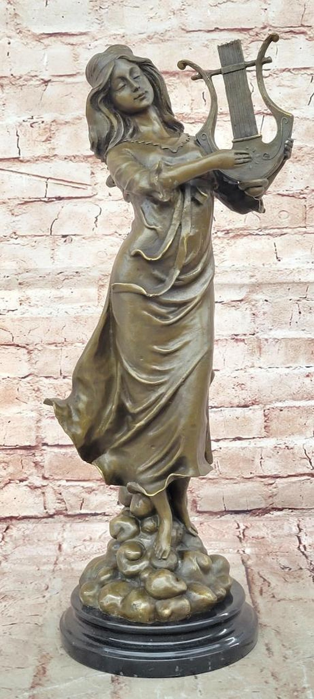 Harp Girl Figurine Bronze Statue by Vitaleh - 19" x 6": Harp Girl Figurine Bronze Statue by Vitaleh - 19" x 6" This elegant bronze sculpture depicts a female musician leaning into her harp, capturing grace, rhythm, and serene beauty. Handmade using