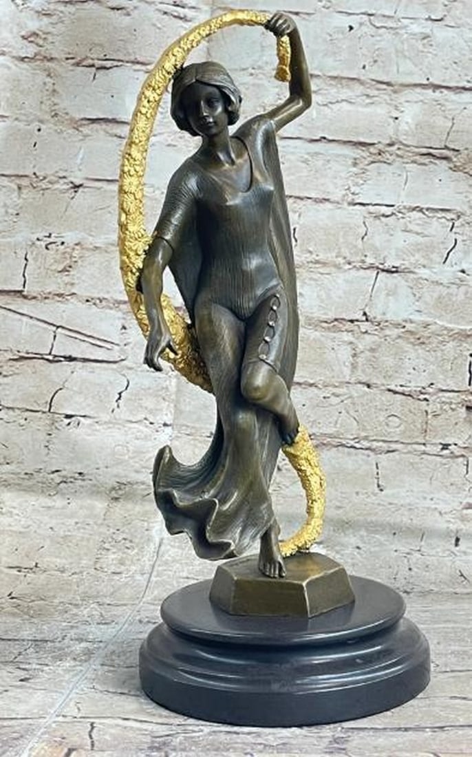 Grace in Motion Bronze Sculpture: Grace in Motion Bronze Sculpture This captivating bronze sculpture immortalizes the fluidity and elegance of dance. A woman, poised and graceful, is captured mid-motion, her dress billowing around