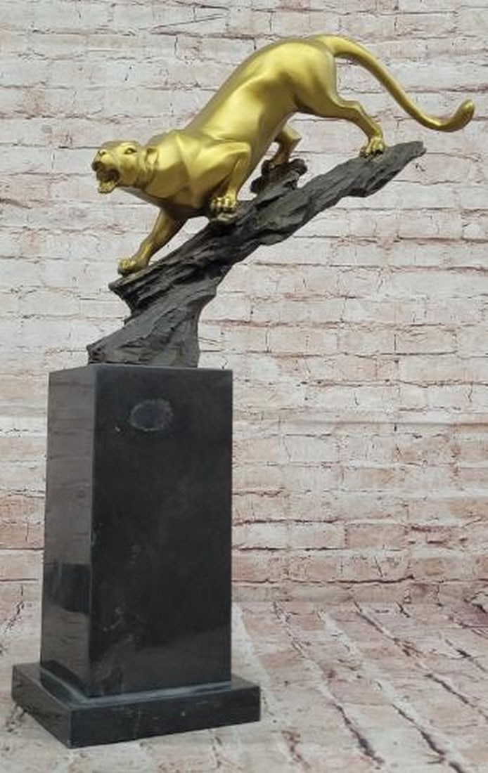 Golden Bronze Panther Statue: Golden Bronze Panther Statue This striking Golden Bronze Panther Statue, bearing the signature of renowned artist Williams, captures the raw power and grace of one of nature's most majestic creatures.