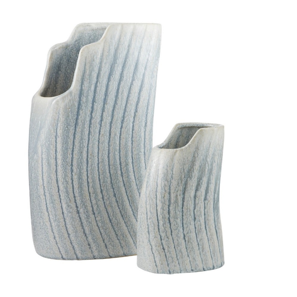 Set of 2 Icy Morn Vases, Casio Collection: Set of 2 Icy Morn Vases, Casio Collection Evoking the rhythmic crash of ocean waves or the graceful curve of a whale's fin, the ribbed texture of our ceramic vessels radiates a natural, organic charm.