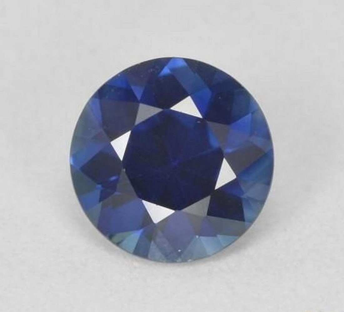 0.66 ct Natural Twilight Blue Sapphire - Diamond-Cut: 0.66 ct Natural Twilight Blue Sapphire - Diamond-Cut Introducing the Natural Twilight Blue Sapphire, a captivating gemstone with a rich, deep blue hue perfect for fine jewelry. Its diamond-cut shape m