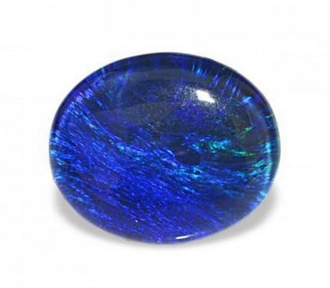 3.21 ct Natural Multicolor Opal Triplet - Oval Cabochon: 3.21 ct Natural Multicolor Opal Triplet - Oval Cabochon Introducing the Natural Multicolor Opal Triplet, a vibrant gemstone that showcases a captivating play of colors in every angle. Its rich multico