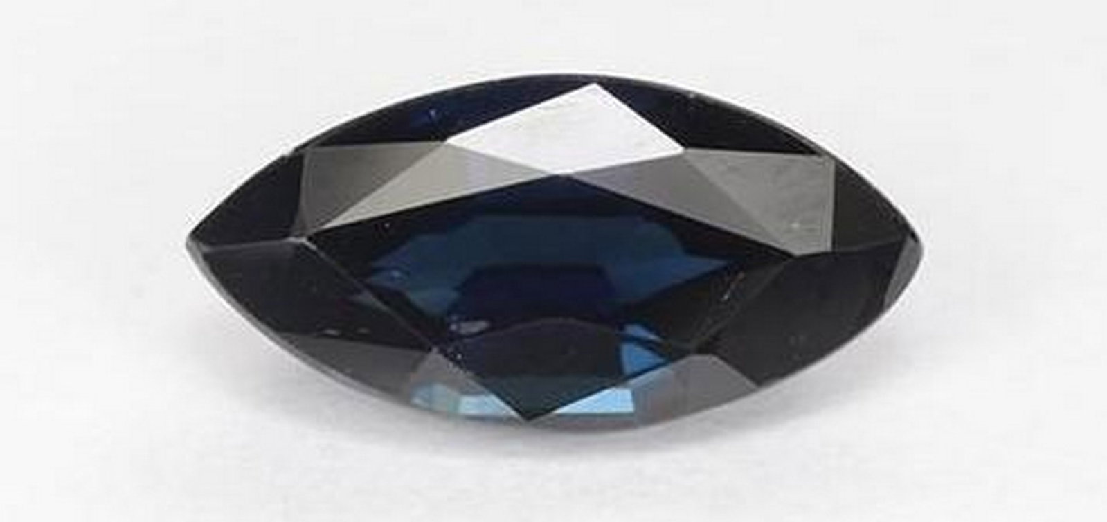 Midnight Blue Sapphire Marquise Faceted Gemstone: Midnight Blue Sapphire Marquise Faceted Gemstone Elegant and alluring, this marquise-cut sapphire shimmers with a deep midnight blue hue that evokes the mystery of a starlit sky. The elongated faceted