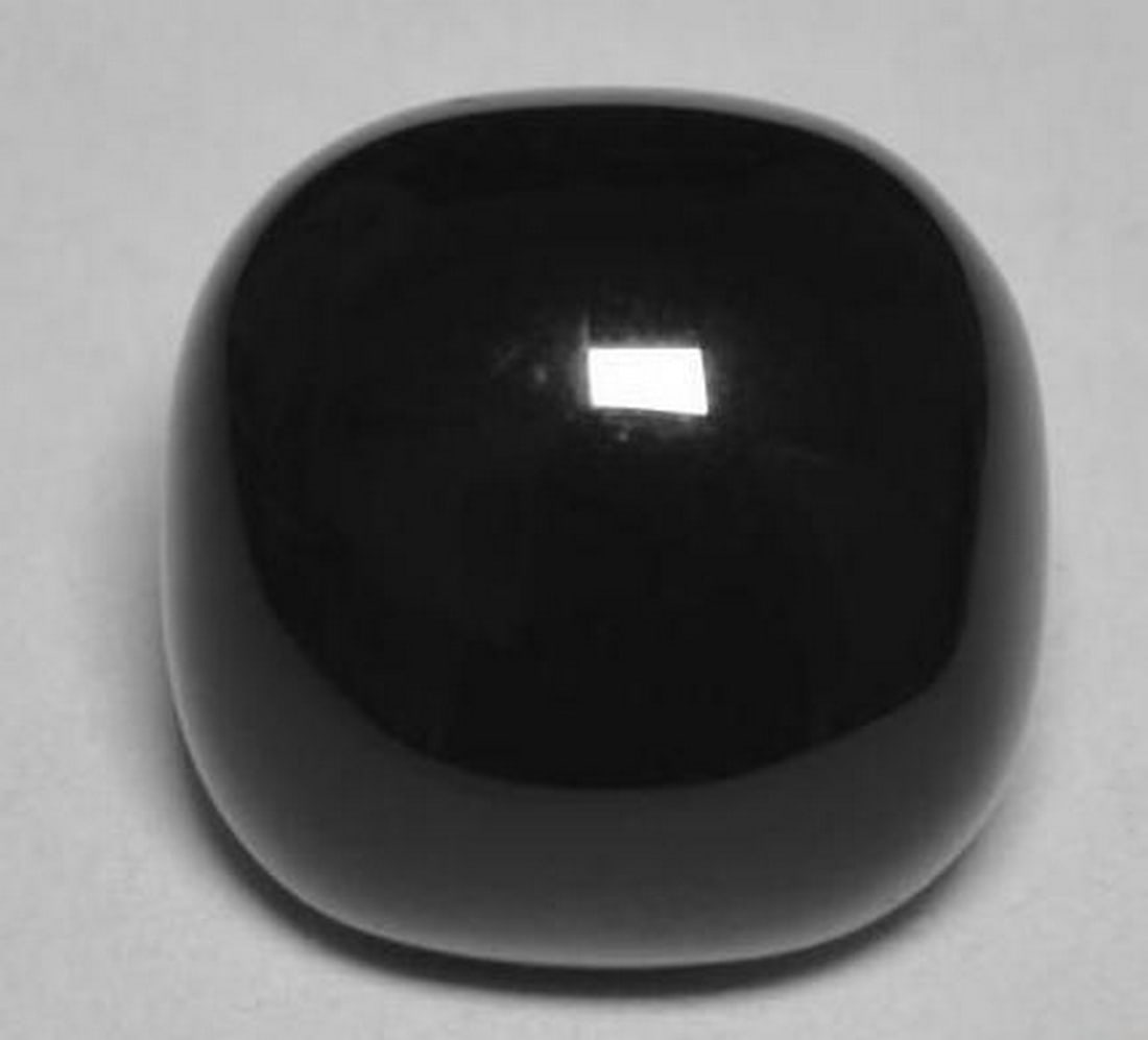 Black Onyx Cushion Cabochon Gemstone: Black Onyx Cushion Cabochon Gemstone This sleek and elegant loose gemstone is a cushion-shaped cabochon of jet-black onyx, showcasing its deep, glossy color. The smooth surface and classic shape highl