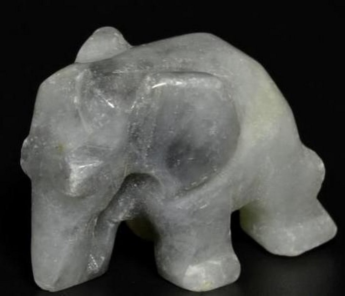 Jadeite Elephant Carving Hand-Carved Gemstone in Medium Grey: Jadeite Elephant Carving Hand-Carved Gemstone in Medium Grey Symbolizing wisdom, strength, and good fortune, this beautifully hand-carved elephant is crafted from genuine Jadeite in a smooth medium