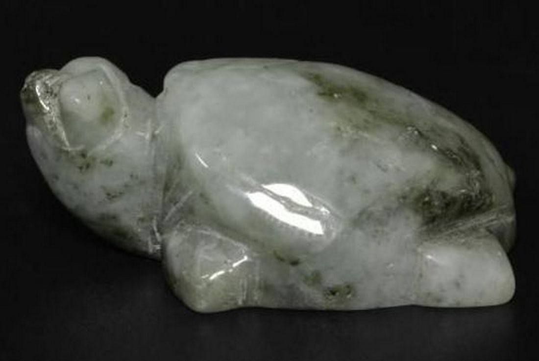 Medium Green Jadeite Carved Turtle Gemstone: Medium Green Jadeite Carved Turtle Gemstone This stunning loose gemstone is expertly carved into the shape of a turtle from medium green jadeite. The turtle, a symbol of longevity and protection, is