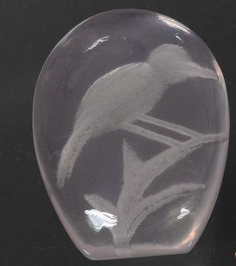 Very Light Pink Rose Quartz Carved Gemstone: Very Light Pink Rose Quartz Carved Gemstone This serene loose gemstone is crafted from delicate rose quartz in a soft, very light pink hue, featuring an intricate carving of a bird perched on a tree