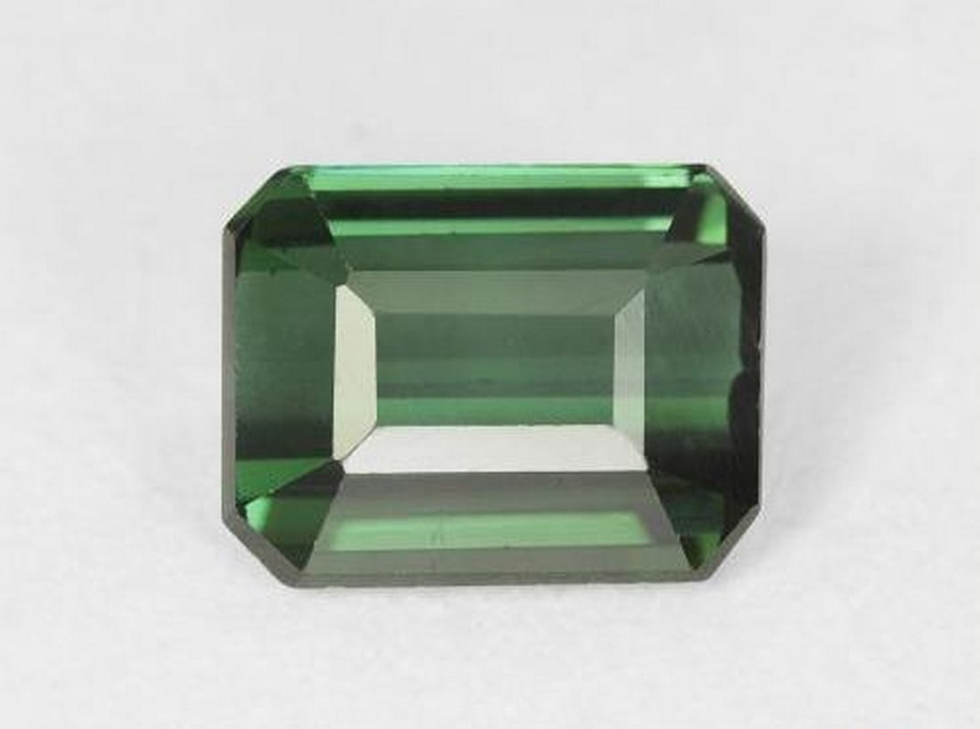 1.51ct Octagon Cut Dark Green Tourmaline: 1.51ct Octagon Cut Dark Green Tourmaline Vibrant deep green, expertly faceted, this tourmaline not only dazzles but is said to bring balance, growth, and emotional healing - perfect for jewelry or a c