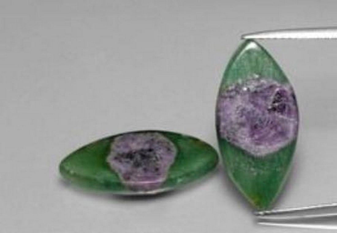 Mystic Duo Marquise Slices of Ruby in Fuchsite: Mystic Duo Marquise Slices of Ruby in Fuchsite This captivating pair of loose gemstones features striking marquise slices of Ruby in Fuchsite, blending vivid purple ruby inclusions with rich green fuc