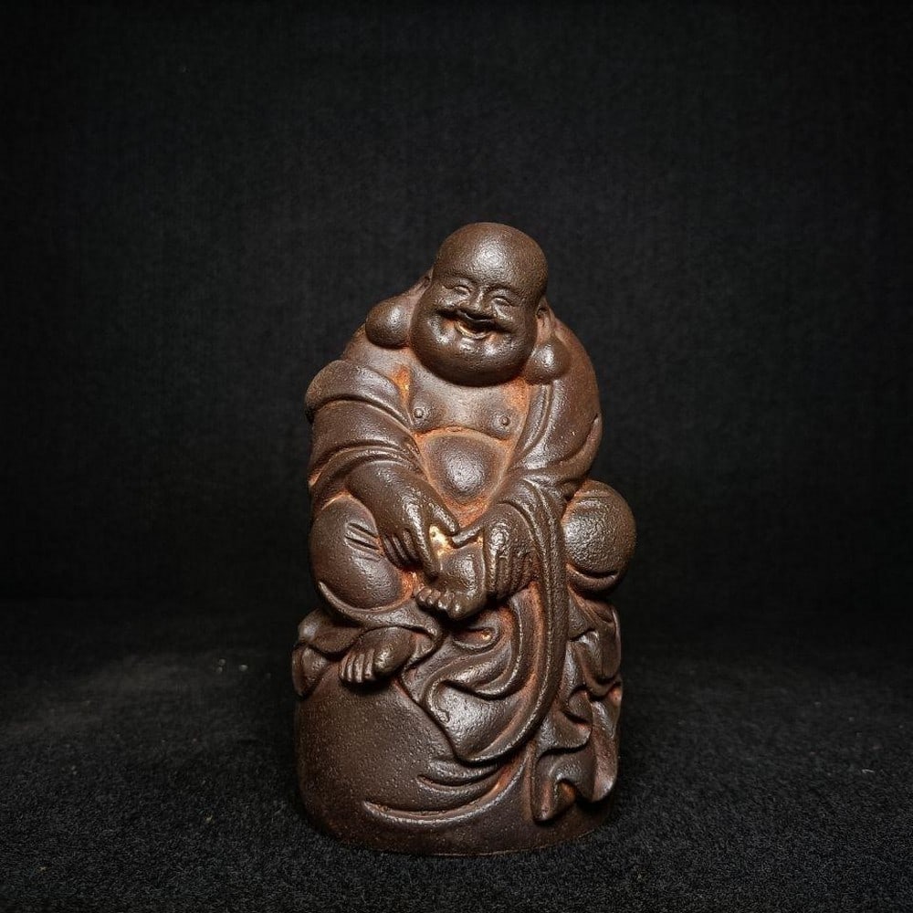 Antique Ironware Smiling Maitreya Buddha Statue: Inspired Antique Ironware Smiling Maitreya Buddha Statue This inspired antique ironware statue depicts the smiling Maitreya Buddha, known for symbolizing happiness, abundance, and good fortune. The