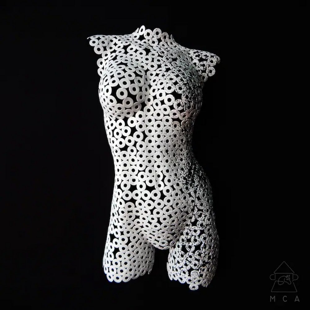 Pure Form - Abstract Metal Female Torso Wall Sculpture: Pure Form - Abstract Metal Female Torso Wall Sculpture A striking fusion of industrial craftsmanship and modern elegance, this handcrafted metal wall sculpture captures the strength and grace of the f