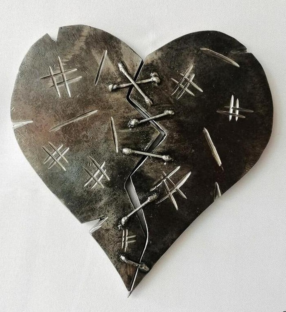Repaired Heart Metal Sculpture: Repaired Heart Metal Sculpture This powerful metal sculpture of a broken heart, delicately repaired, symbolizes the hope of healing and the magic of life s possibilities. Handmade from metal by skille