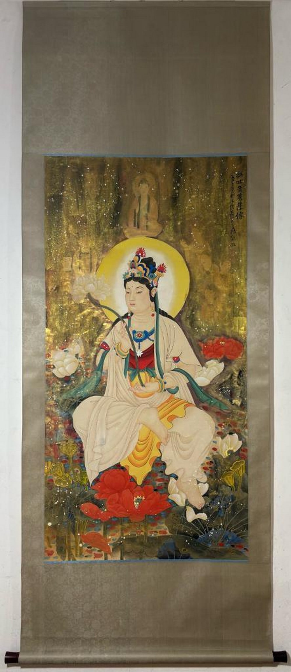 Inspired Blossoms of Mercy Scroll Painting: Inspired Blossoms of Mercy Scroll Painting This ethereal scroll painting inspired by Zhang Daqian presents the Bodhisattva Guanyin in a moment of divine stillness, holding a delicate lotus flower as a