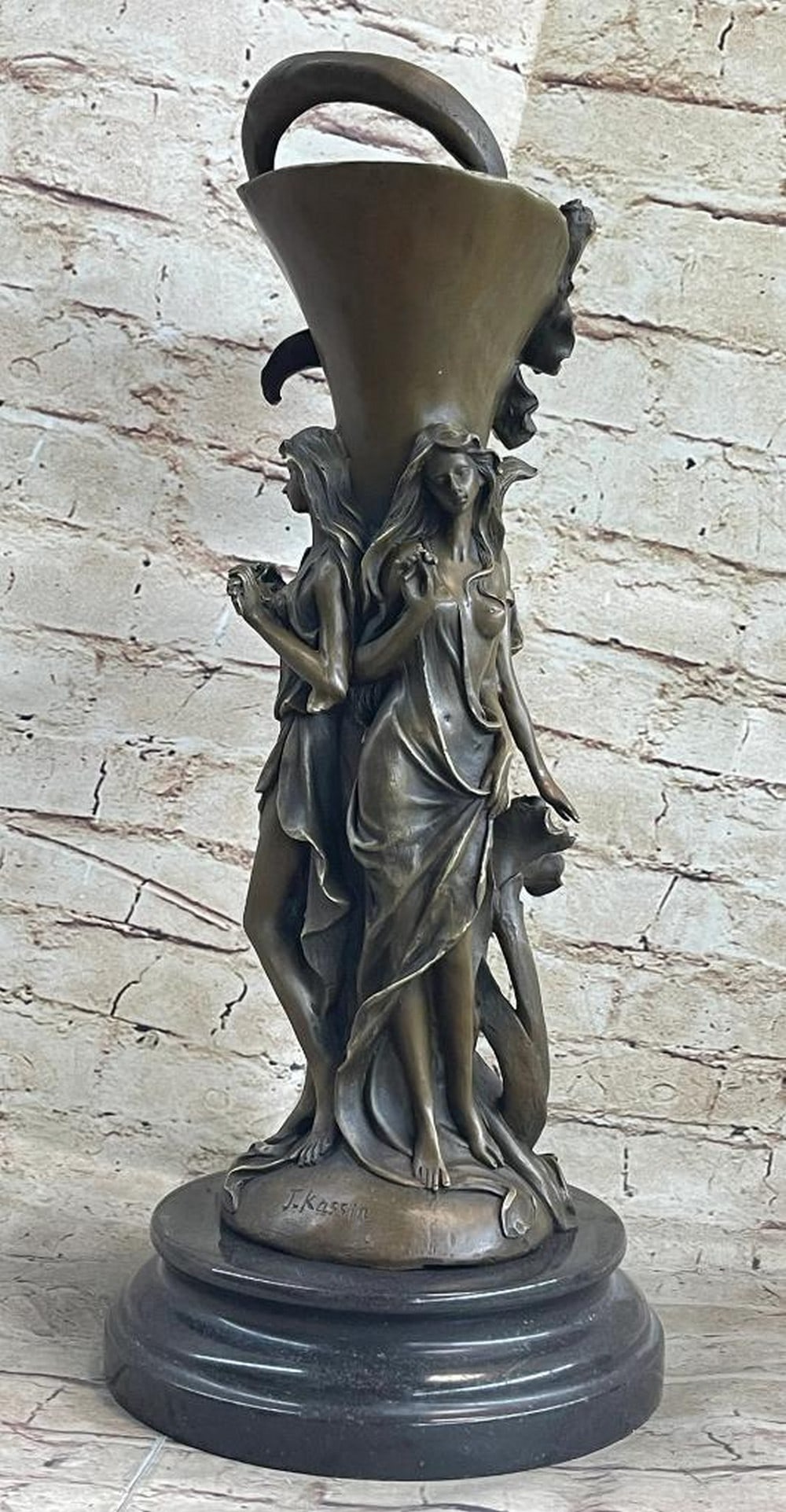 Enchanted Bloom Three Nymphs Bronze Vase by J. Kassin - 18'' x 8'': Enchanted Bloom Three Nymphs Bronze Vase by J. Kassin - 18 x 8 This exquisite bronze vase by J. Kassin, titled Enchanted Bloom, showcases a trio of graceful nymphs encircling the vessel in a stunning 
