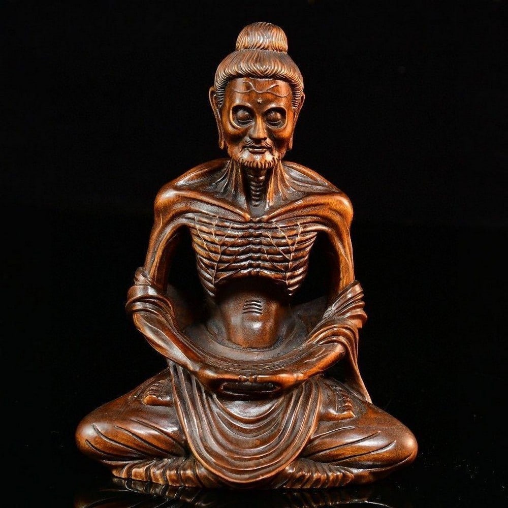 Boutique Wood Carving of Skinny Luo Han: Boutique Wood Carving of Skinny Luo Han A distinctive wooden sculpture of a skinny Luo Han (Arhat), masterfully carved with fine detail and expressive features. This boutique piece captures the emacia