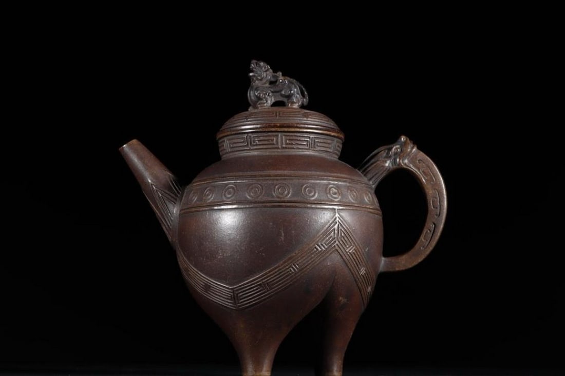 Beast Bronze-Style Zisha Teapot With Xu Youquan Mark, Ming Dynasty Style: Beast Bronze-Style Zisha Teapot With Xu Youquan Mark, Ming Dynasty Style. A finely crafted Zisha (purple clay) teapot in bronze style, featuring a distinctive beast on the lid and marked with the name