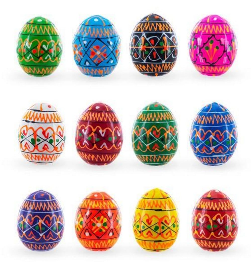 Twelve Mini Symbols of Spring Eggs: Twelve Mini Symbols of Spring Eggs This exquisite set of 12 mini hand-painted wooden eggs are adorned with vibrant and intricate designs. These eggs showcase a stunning array of colours-accented with 