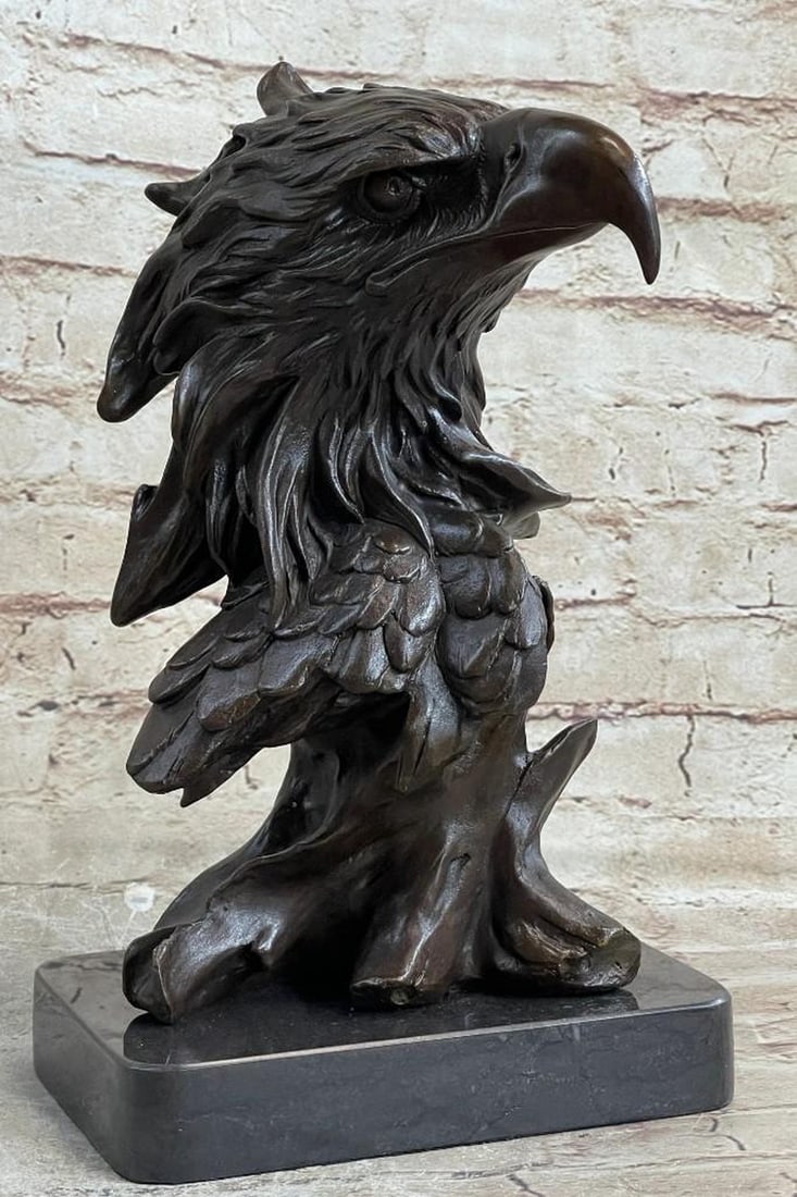 American Eagle Perched On Tree Bronze Sculpture: American Eagle Perched On Tree Bronze Sculpture The bust of the eagle head captures the essence of the majestic bird of prey. The eagle s very large hooked beak (coated in a gold patina) is used for t
