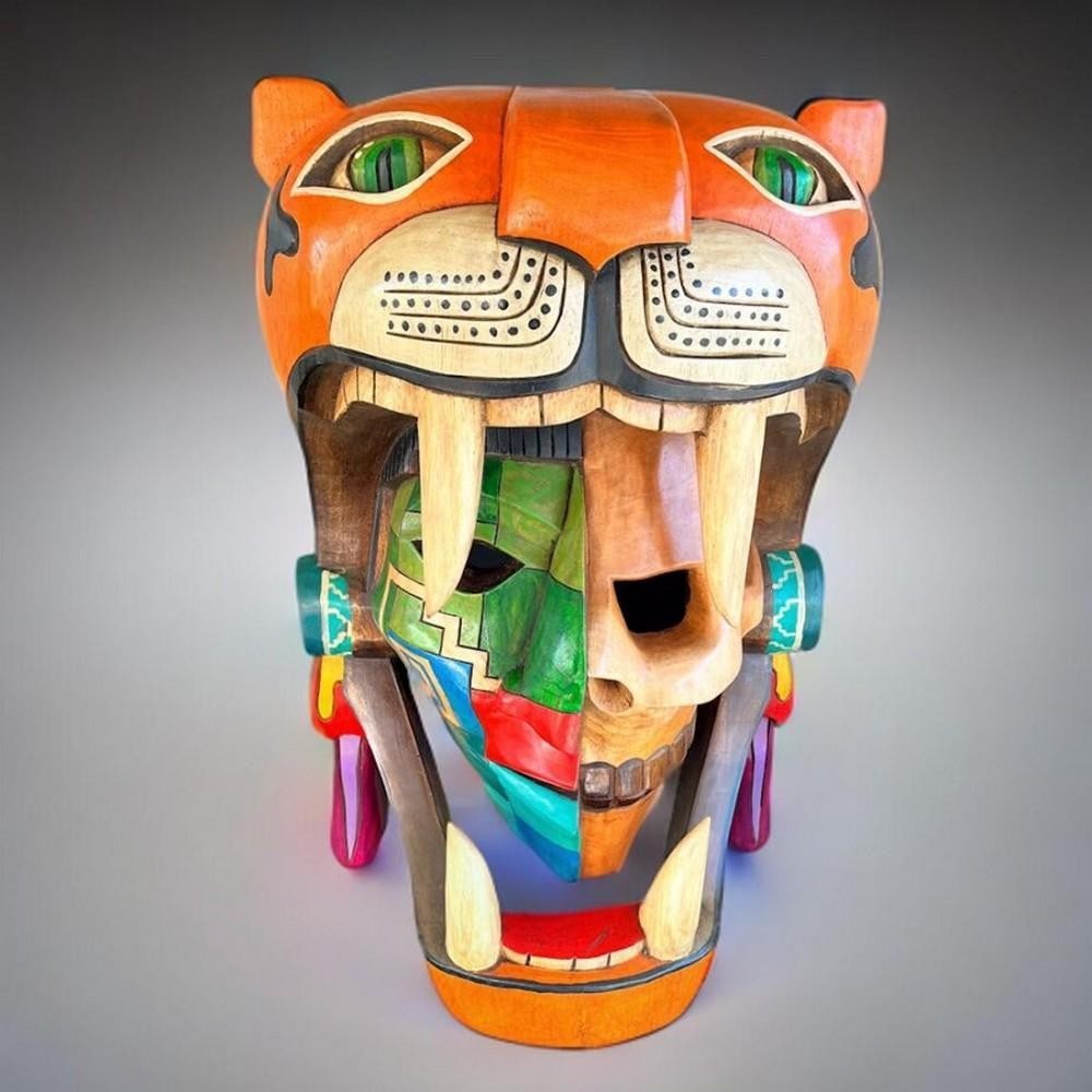Aztec Jaguar Warrior Wooden Mask: Aztec Jaguar Warrior Wooden Mask Hand-carved from cedar wood, this striking 3D mask honors the fierce Jaguar Warriors of the Aztec Empire. With bold colors and masterful detailing, it captures the spi
