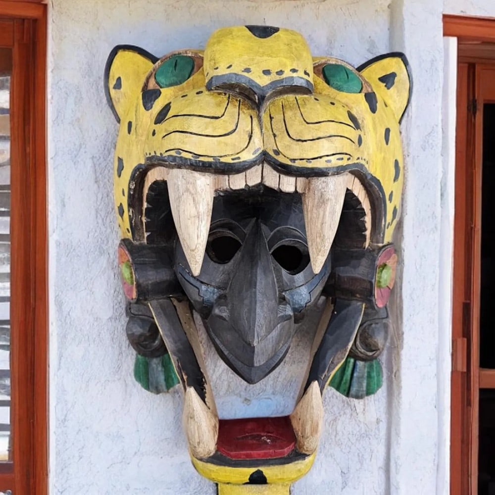 Hand Carved Aztec Jaguar Warrior Mask: Hand Carved Aztec Jaguar Warrior Mask This mask showcases a striking 3D representation of a Jaguar Warrior, an elite class of infantry soldiers in the Aztec army. Alongside the Eagle Warriors, they fo
