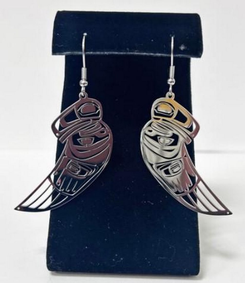 Shadow Wing Earrings: Shadow Wing Earrings The Shadow Wing Earrings embody the mystery and intelligence of the raven. Crafted from durable stainless steel, these sleek earrings feature elegantly detailed wings that capture
