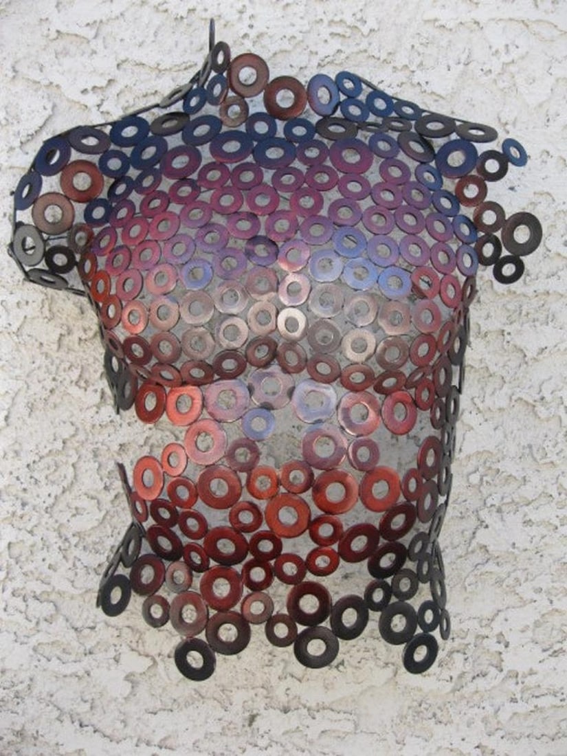James Metal Torso Sculpture: James Metal Torso Sculpture This powerful male torso sculpture blends form, texture, and dynamic color, making it a standout piece for any collection. Hand-formed and welded, its fine details are achi