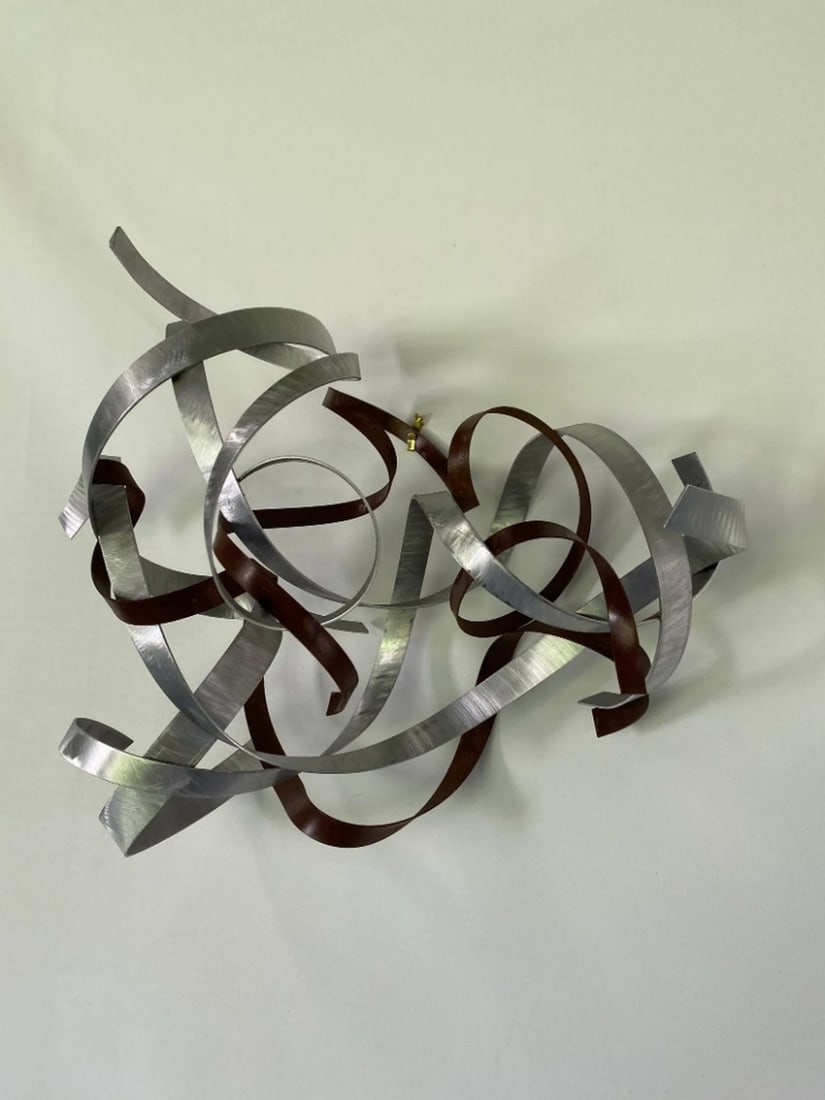 Abstract Wall art Sculpture: Abstract Wall Art Sculpture Enhance your space with Wall Twist and Turns, a handcrafted abstract metal wall art piece that seamlessly complements contemporary, traditional, or minimalist decor. This s