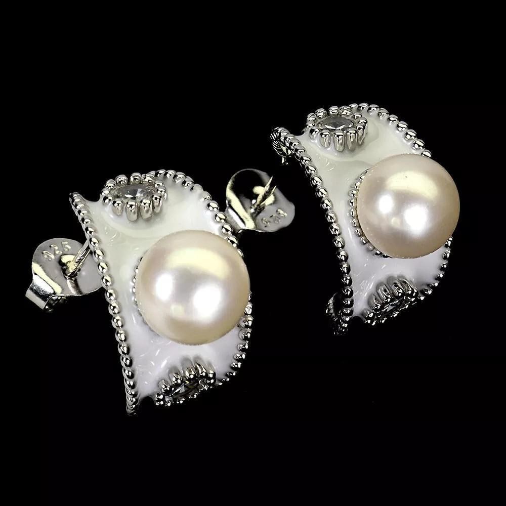 Classic 8mm Pearl and Simulated CZ Sterling Silver Earrings: Classic 8mm Pearl and Simulated CZ Sterling Silver Earrings These classic 8mm pearl earrings feature sparkling simulated CZ gemstones set in high-quality 925 sterling silver. Their timeless design add