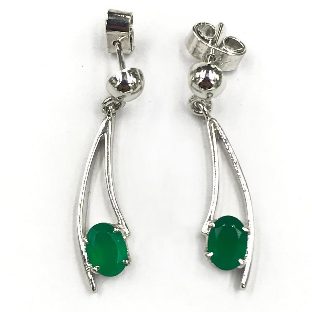 Enclosed Green Onyx Dangle Earrings: Enclosed Green Onyx Dangle Earrings Green onyx is said to represent intelligence, elevated brain power, and enhanced memory. It is a stunning deep green colour that can be the perfect accessory. View