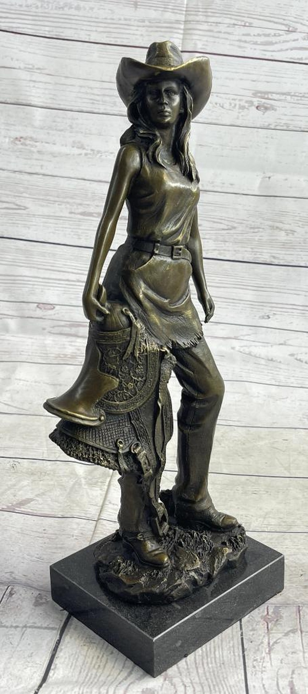 Western Cowgirl Bronze Sculpture - 15'' x 6'': Western Cowgirl Bronze Sculpture - 15'' x 6'' Standing tall and proud, this western rose proves that the range isn` t just for the boys! Expertly cast in real bronze, this lasso wielding lady has b