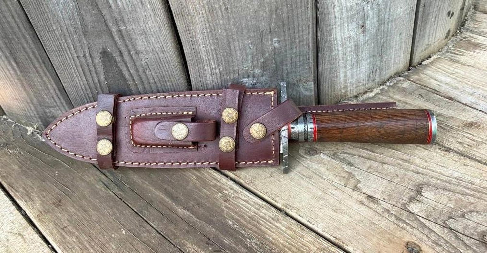 The Northern Boundary Damascus Dagger: Custom Handmade Damascus Steel Dagger Hunting Dagger Knife Handle Walnut Wood with Brass Spacer Damascus Steel Blade with 256 Layers on it. HARDNESS 56-60 H R C VERY HIGH QUALITY GENUINE LEATHER SHEAT