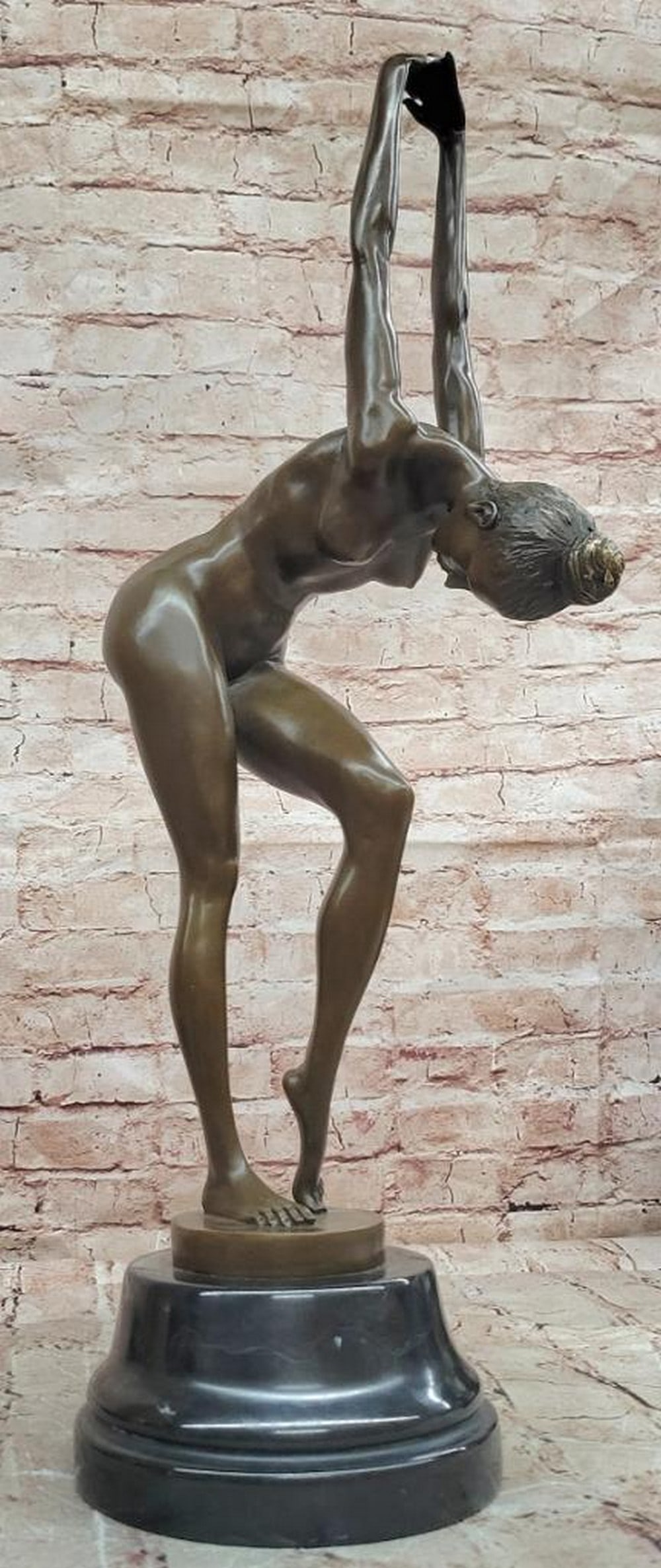 Cesaro Original Bronze Nude Dancer Sculpture - 23'' x 6.5'': Cesaro Original Bronze Nude Dancer Sculpture - 23'' x 6.5'' This original bronze sculpture depicts a nude dancer captured in a balanced, expressive pose. The figure is rendered with smooth contours an