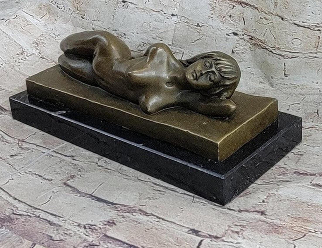 Bronze Sculpture of A Nude Female Model Posing Beautifully - 5'' x 12'': Bronze Sculpture of A Nude Female Model Posing Beautifully - 5'' x 12'' The nude beauty reclines on her left side, adorned with a serene smile of quiet bliss. Her pose exudes a naturalistic charm, bri