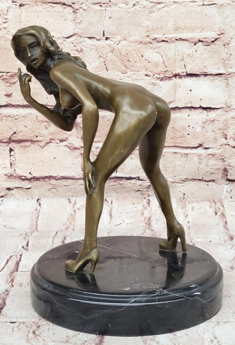 Nude Seductress Looking Back Inspired Bronze Sculpture by Mavchi - 9.5'' x 6.5'': Nude Seductress Looking Back Inspired Bronze Sculpture by Mavchi - 9.5'' x 6.5'' This exquisite bronze sculpture by Mavchi portrays a nude seductress gracefully reclining on the ground, embodying femi