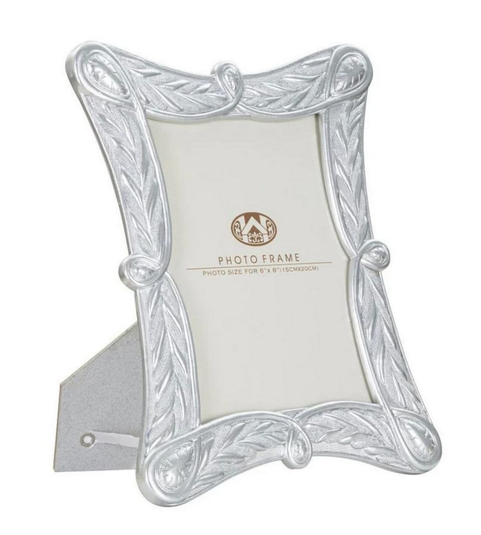 Antique Silver Elegant Photo Frame: Antique Silver Elegant Photo Frame Polyresin frame with glass, featuring elegant geometric lines that evoke nature, ideal for framing your cherished memories in a contemporary and distinctive style. I