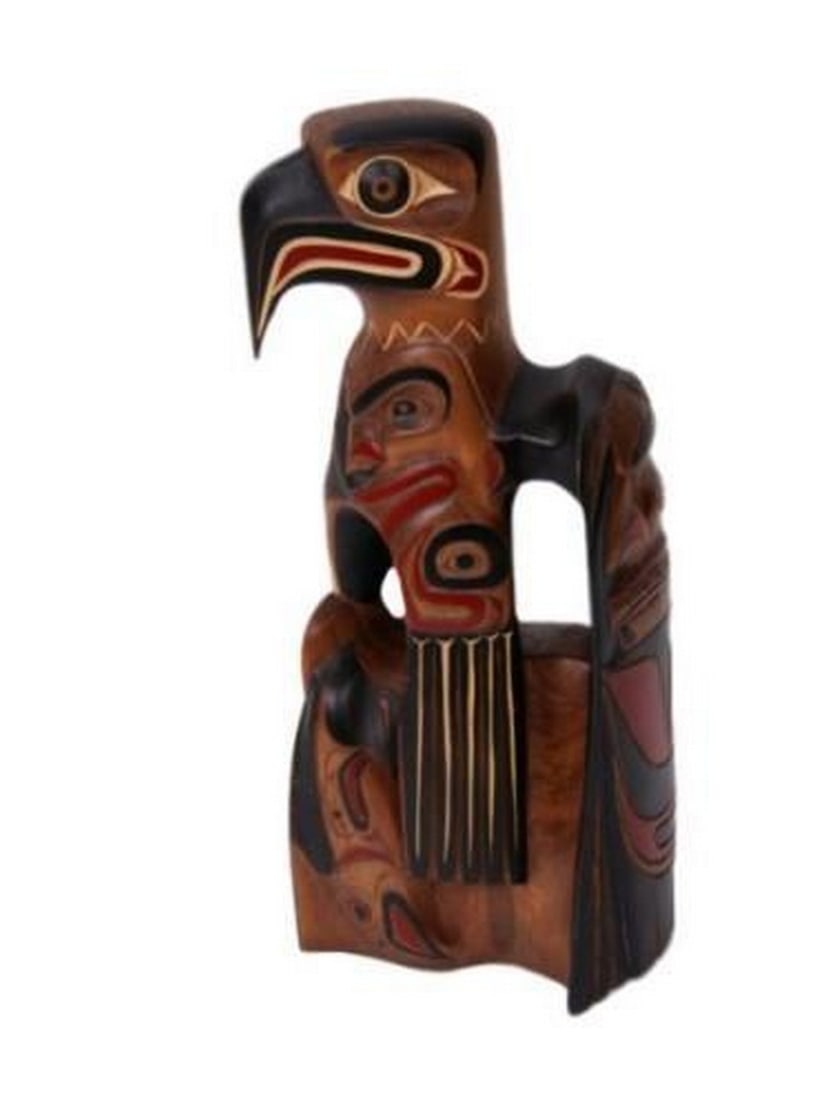 Wings of the Salish Spirit Sculpture: Wings of the Salish Spirit Sculpture Created from a triangular piece of wood with a burl. This unique sculpture was created by a master carver. An eagle crowns this piece with a wing opening to the si