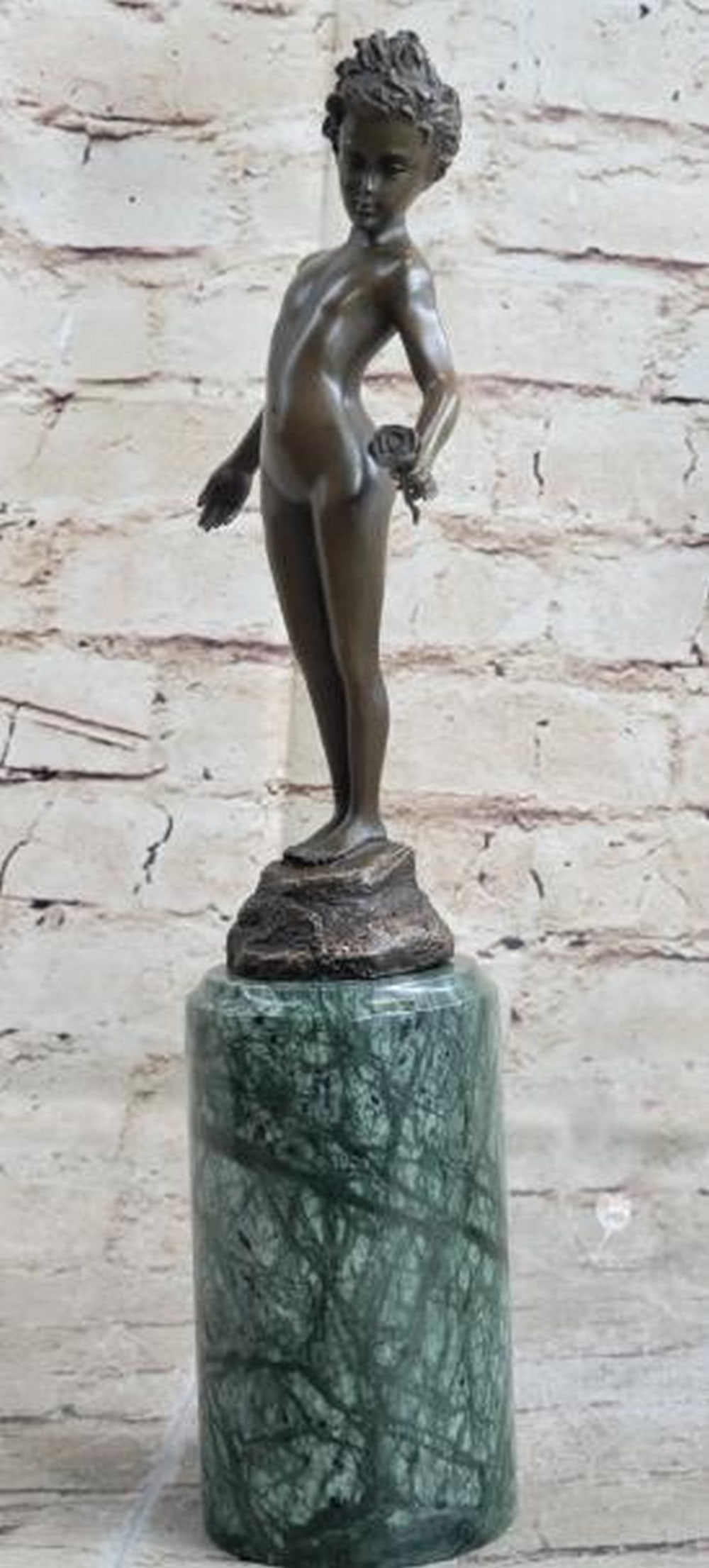 Innocence in Bloom Bronze Sculpture: Innocence in Bloom Bronze Sculpture This delicate reproduction bronze sculpture, bearing the signature of artist Milo, captures the timeless elegance of Art Deco and Nouveau influences. The piece feat