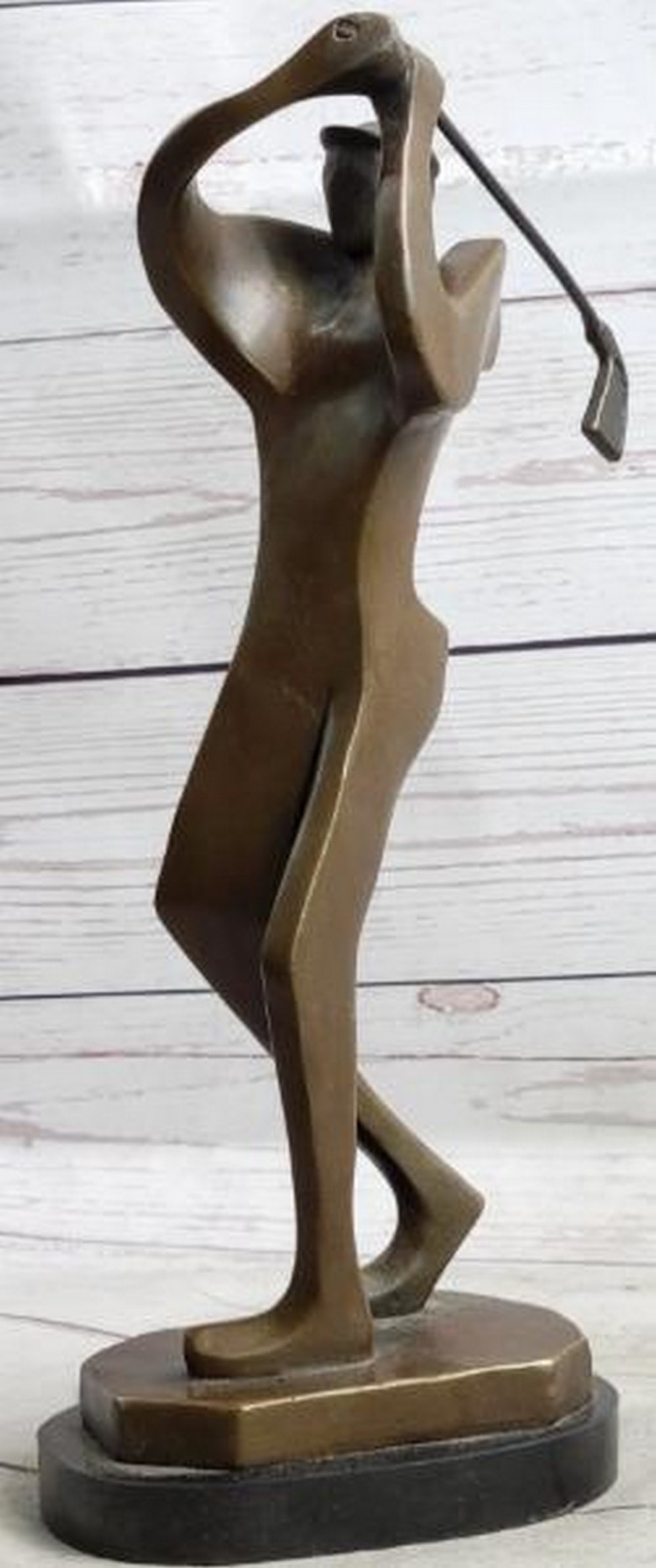 Follow Through: Abstract Bronze Golfer Sculpture: Follow Through: Abstract Bronze Golfer Sculpture A sleek and stylized bronze sculpture capturing the essence of motion in a single, powerful gesture. This abstract golfer is frozen mid-swing, their