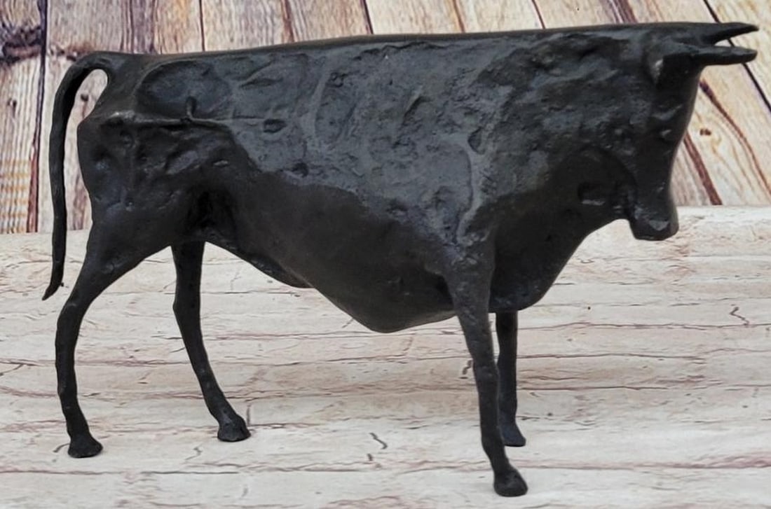 Cubist Charge: Picasso-Inspired Bronze Bull Sculpture: Cubist Charge: Picasso-Inspired Bronze Bull Sculpture A striking modern art cubist bull sculpture cast in bronze with a sleek black patina, this reproduction captures the bold, angular energy of