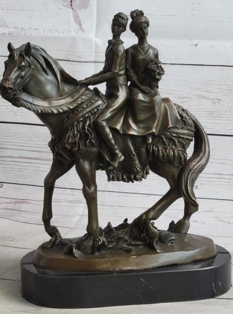 Elegant Bride and Groom on Horse Bronze Sculpture: Elegant Bride and Groom on Horse Bronze Sculpture Grace and romance come together in this beautifully detailed bronze sculpture depicting an elegant bride and groom riding together on horseback, a
