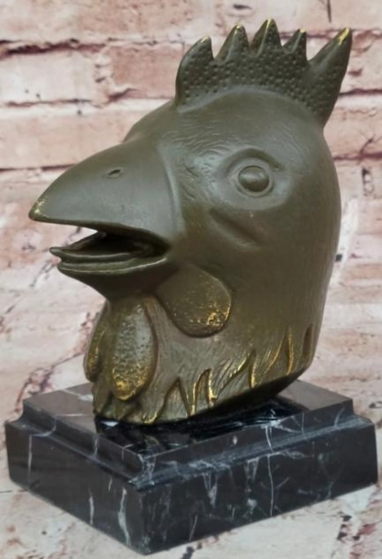 Regal Roost: Bronze Rooster Head Bust on Marble Base: Regal Roost: Bronze Rooster Head Bust on Marble Base Bold and dignified, this bronze rooster head bust captures the proud spirit of the barnyard sentinel with remarkable detail. From the finely