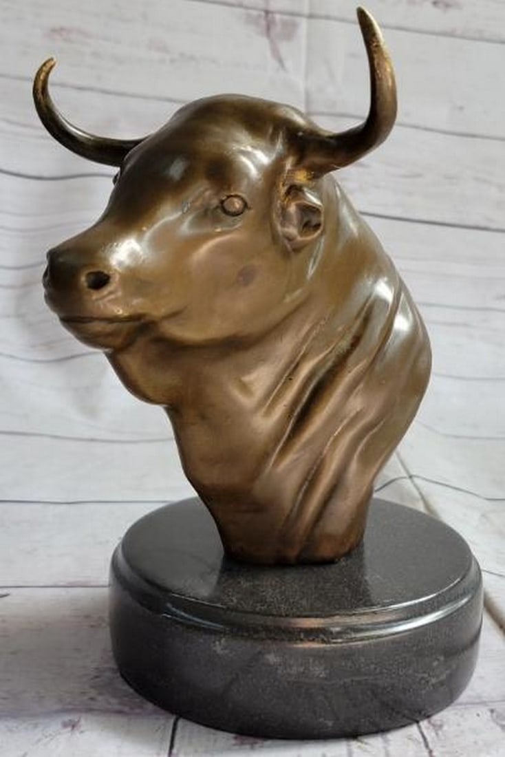 Power Forged in Bronze: Bull Head Bust Sculpture: Power Forged in Bronze: Bull Head Bust Sculpture A commanding bronze metal bust sculpture capturing the raw strength and primal presence of the bull. Set atop a polished marble base, this powerful