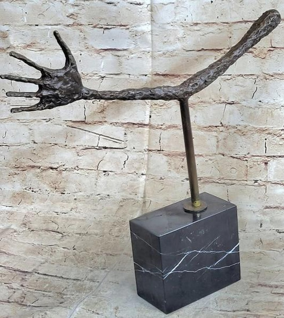 Gesture in Silence Bronze Sculpture: Gesture in Silence Bronze Sculpture This hauntingly minimal bronze sculpture, bearing the signature of Alberto Giacometti, features a solitary, abstracted arm, elongated, rugged in texture, and held u