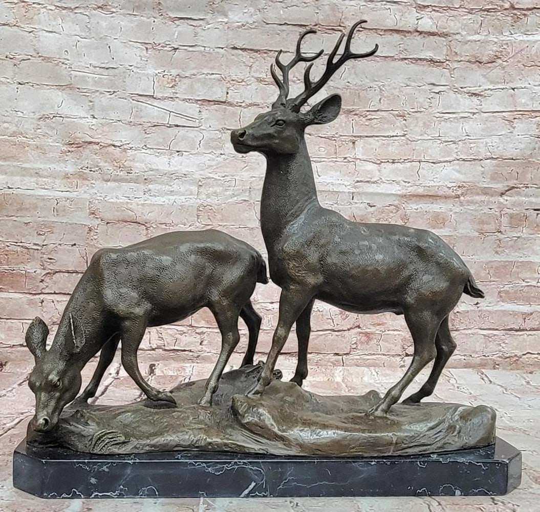 Male and Female Deer Bronze Statue - 15.5" x 17": Male and Female Deer Bronze Statue - 15.5" x 17" This original bronze statue depicts a male and female deer in a serene moment of natural harmony, with the stag standing alert beside the gentl