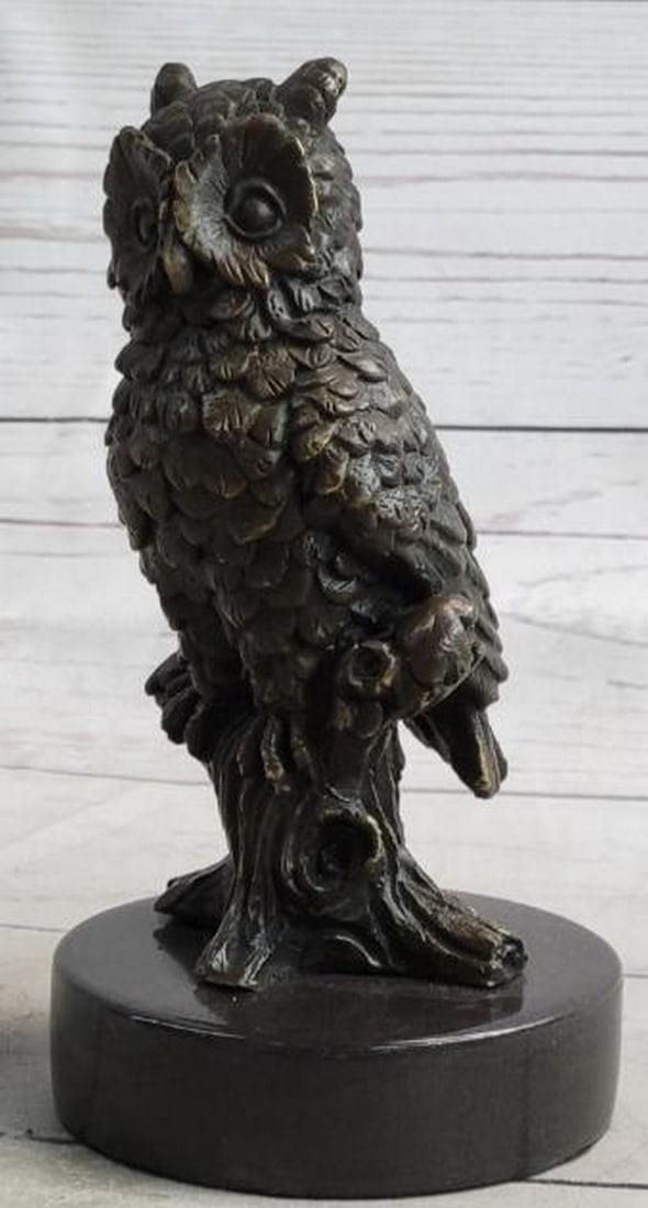 Alert Owl on Branch Realistic Bronze Sculpture: Alert Owl on Branch Realistic Bronze Sculpture This finely crafted bronze sculpture captures the sharp gaze and poised stillness of a realistic owl, standing alert atop a tree trunk or branch. With in